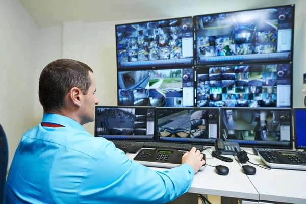 Commercial Surveillance and Security Systems in Tucson Commercial security staff using a surveillance system in Tucson