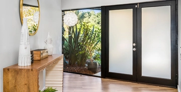 Frosted decorative window fil in a home front entry door Frosted decorative window fil in a home front entry door