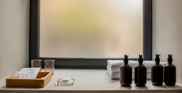 Frosted decorative window glass in a home bathroom window