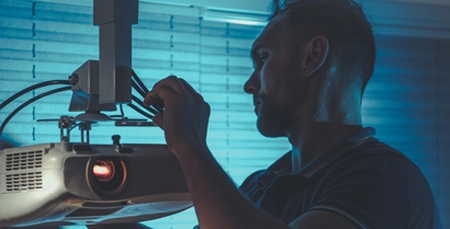 Proyector or large TV for home cinema installation Technology Specialist technician installing a proyector for a Home Theater installation in Tucson