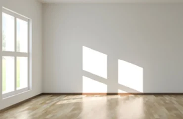 home-window-tinting-uv-protection-living-room Bright living room with home window tinting softening direct sunlight and glare